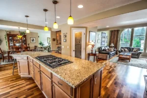 Modern kitchen interior design featuring clean white cabinetry and stainless steel appliances in a renovated family home.